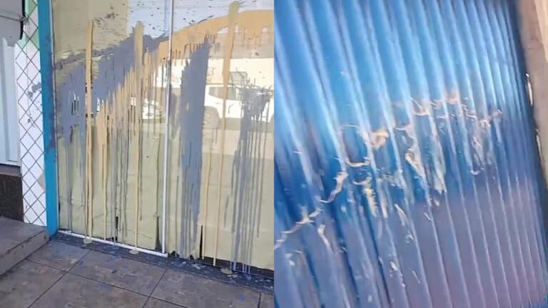 Crianças jogam baldes de tinta em porta de casa e comércio no distrito de JK, em João Pinheiro